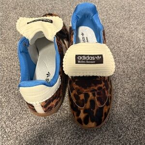Leopard Sneakers. Never worn. Men’s size 9.5 women’s size 11